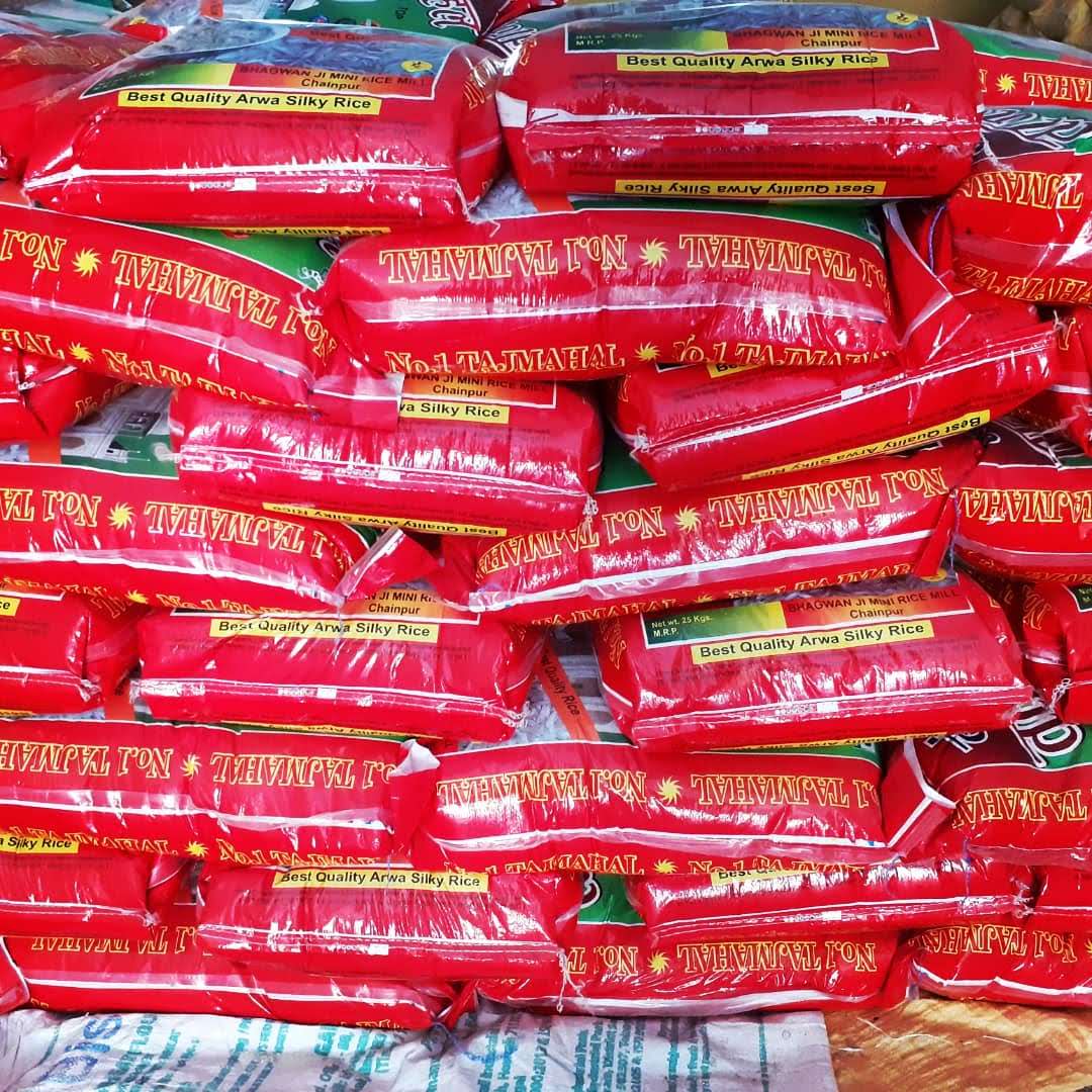 Rice sacks stacked at the storage yard in daylight